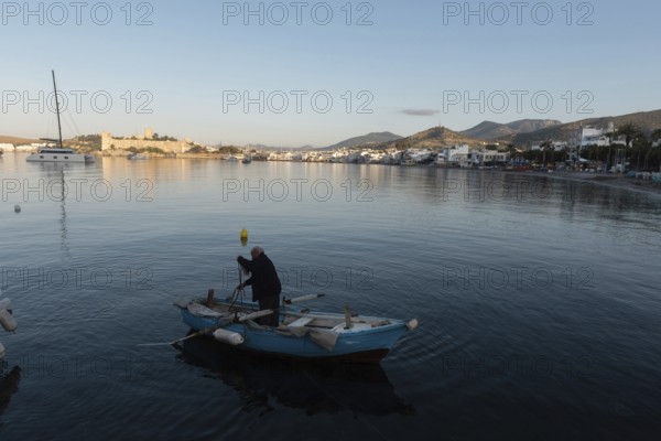 Bodrum, Mugla, Turkey. April 21st 2022 A fisherman at dawn in the beautiful harbour of Bodrum on