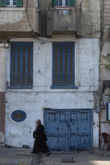 Alexandria, Egypt. December 3rd 2022. Blue painted doors and windows of faded traditional