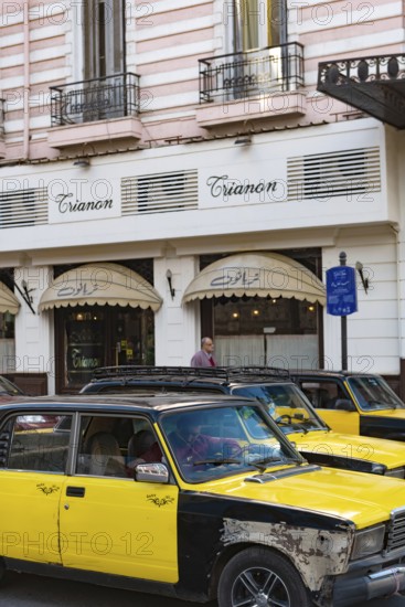Alexandria, Egypt. December 4th 2022 A black and yellow Alexandria taxi in the street outside the