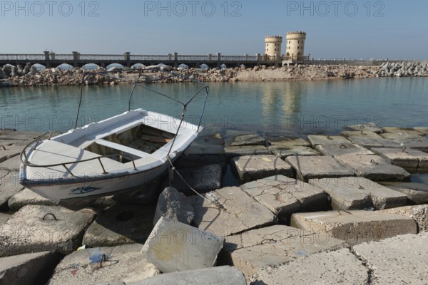 Alexandria, Egypt. December 1st 2022 A boat on concrete blocks positioned as a defence against