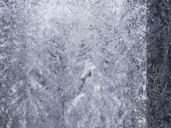 Close-up of a window with frozen ice forming intricate patterns, Frankenwald nature park Park