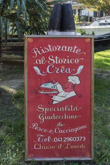 Advertising sign for a restaurant on the island of Giudecca, Venice, Veneto, Italy