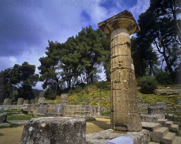 Hera Temple, Temple of Hera, Heraion, Single tall pillar in a natural setting under cloudy sky,