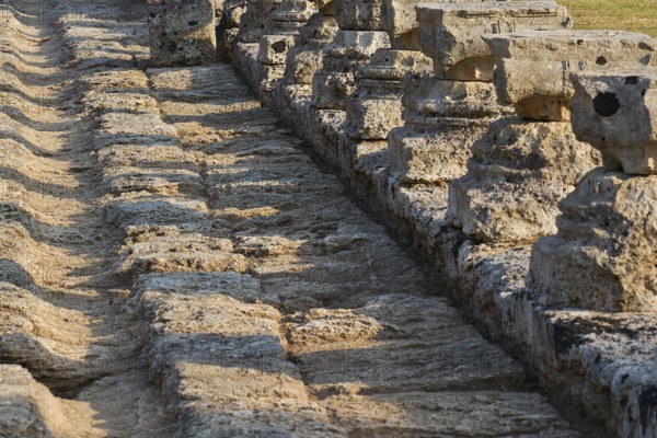Set of ancient stones with long shadows showing detail, Archaeological Site, Ancient Olympia,