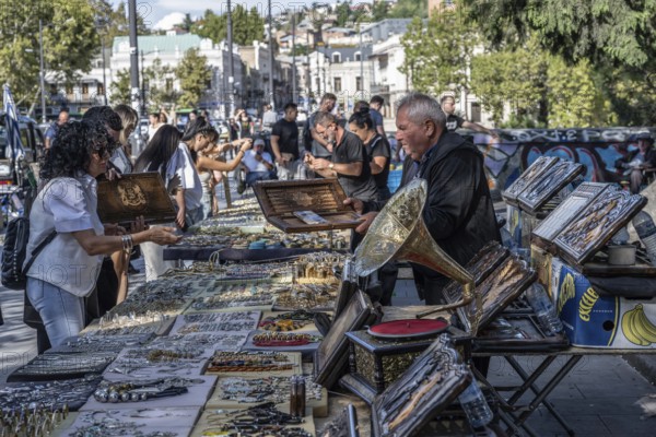 Tbilisi, Georgia. September 12th 2025. Street stall vendors and people shopping at the Dry Bridge