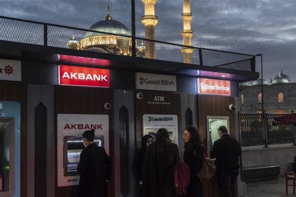 Istanbul, Turkey 8th January 2025 Customers using Turkish bank ATM's near the Bosporus on the