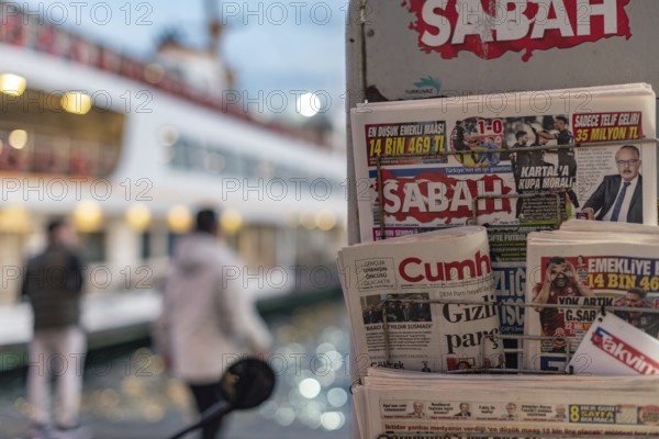 Istanbul, Turkey. January 8th 2025. Turkish daily newspapers displayed on a stand at Karakoy Ferry
