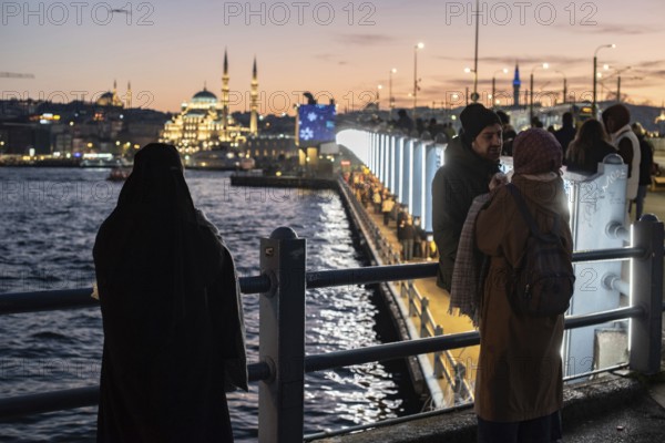 Istanbul, Turkey. January 3rd 2025. Tourists and locals gather at sunset on the iconic Galata