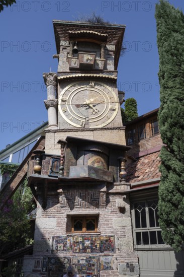 Tbilisi, Georgia. August 5th 2025. The ornate clock tower of the Gabriadze Marionette Theater,