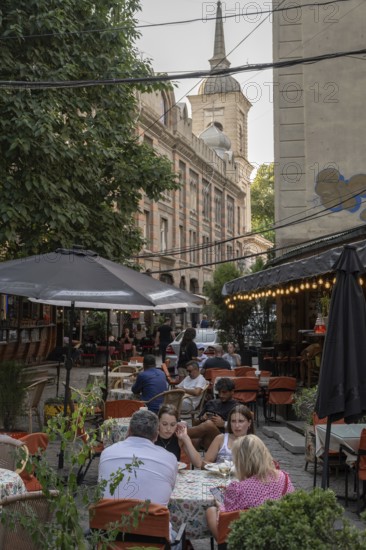 Tbilisi, Georgia. July 29th 2025. Locals and tourists enjoying the café culture of the Old Town in