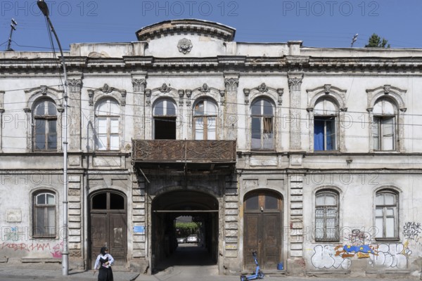 Tbilisi, Georgia. August 5th 2025. An old traditional style Georgian building façade leading to a