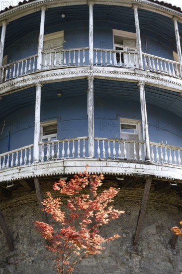 Tbilisi, Georgia. August 5th 2025. An old traditional blue painted Georgian building with a typical