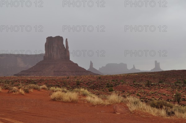 View of Monument Valley's distinctive rock formations after a heavy thunderstorm. Monument Valley,