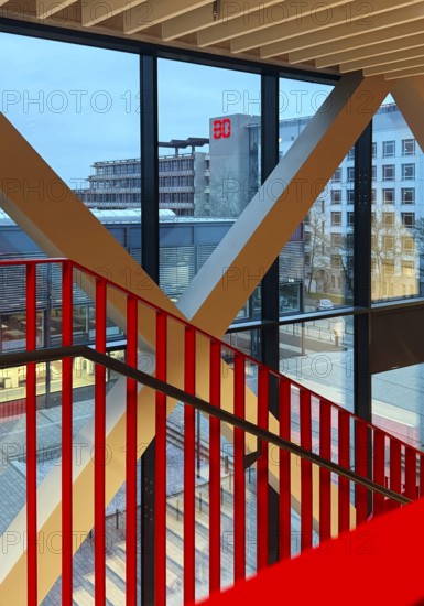 Staircase with signal red color scheme in seminar building H of Bochum University in the evening