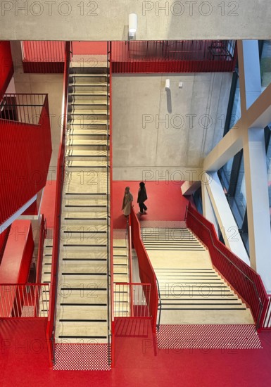 Staircase with signal red color scheme in seminar building H of Bochum University, Ruhr area, North