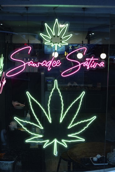 Bangkok, Thailand. March 12th 2025. Illuminated neon green cannabis leaf sign in the Patpong Night