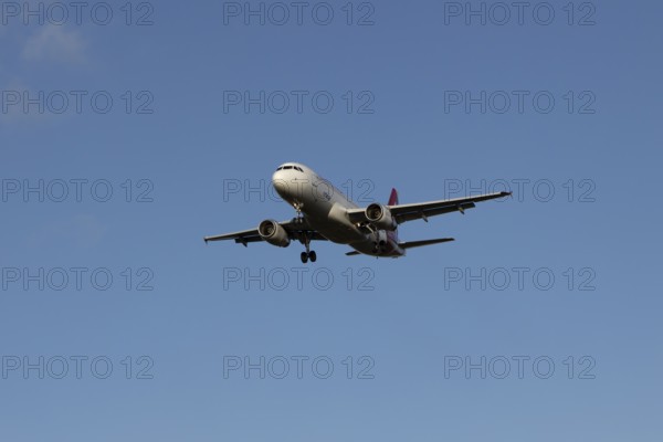 Airbus A320 commercial passenger airliner jet aircraft of Electra airlines flying on approach to