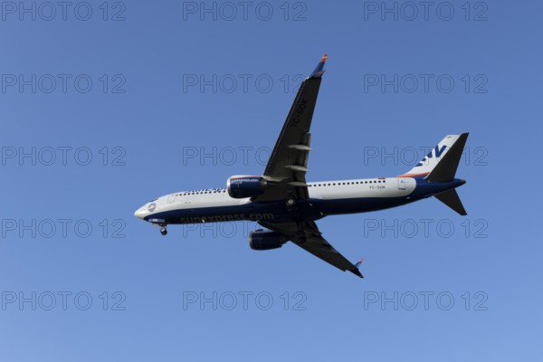 Boeing 737 commercial passenger airliner jet aircraft of SunExpress airways in flight on approach