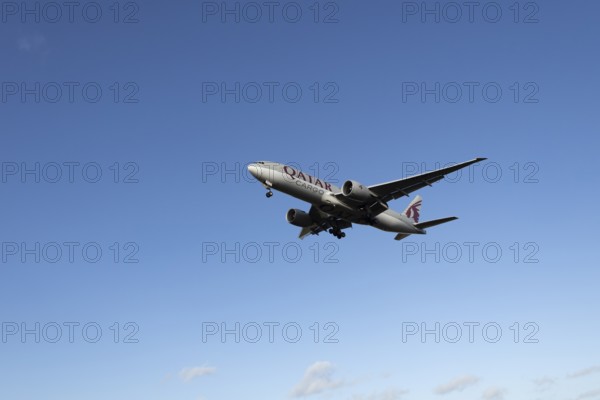 Boeing 777 A7-BFL commercial jet aircraft of Qatar cargo in flight on approach to land at London