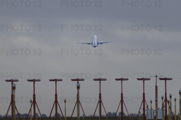 Boeing 737 commercial passenger airliner jet aircraft taking off in flight at London Stansted