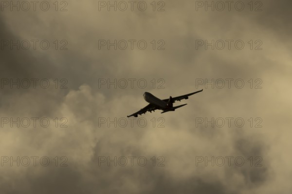 Boeing 747-400 jumbo jet LX-TCV commercial aircraft of Cargolux cargo in flight silhouette at