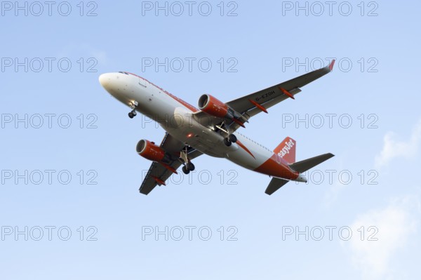 Airbus A320 commercial passenger airliner jet aircraft of Easyjet airlines flying on approach to