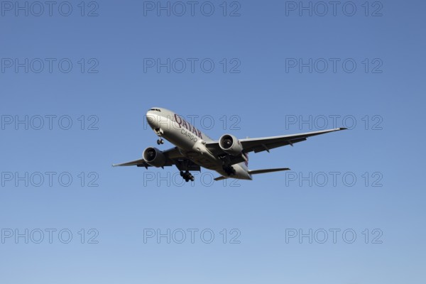 Boeing 777 commercial jet aircraft of Qatar cargo in flight on approach to land at London Stansted