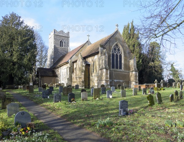 Village parish church of Saint Mary, Martlesham, Suffolk, England, UK and its rural churchyard with