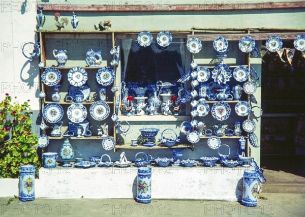 Shop front display of blue and white ceramic Alcobaça style pottery, Portugal, Europe 1968