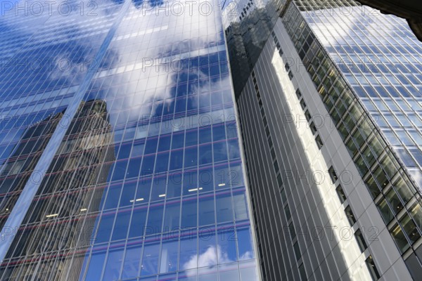 Modern abstract reflections in glass fronted commercial office buildings in the financial district