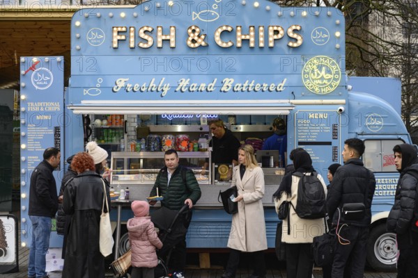 A blue retro Citroen food truck selling traditional British fish and chips on the south bank of the