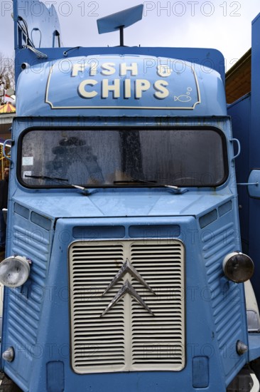 A blue retro Citroen food truck selling traditional British fish and chips on the south bank of the