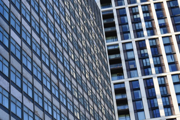 Abstract modern glass fronted designed offices and apartment buildings, high rise property in