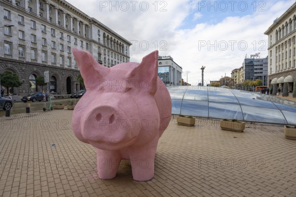 Sofia, Bulgaria. November 23rd 2025. A mock pink piggy bank instillation as a visual protest