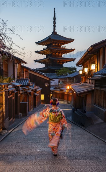 Japanese woman wearing kimono in an alley, Yasaka dori historic alleyway in the old town with