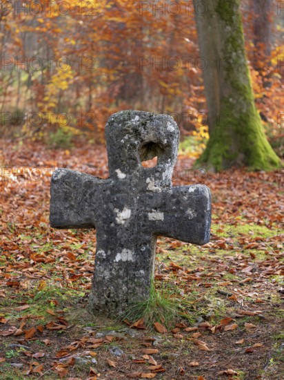 Medieval stone cross in the forest in autumn, atonement cross, murder cross, court cross, Spaal