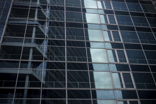 Abstract architecture of a glass fronted office building in a Paris commercial and financial