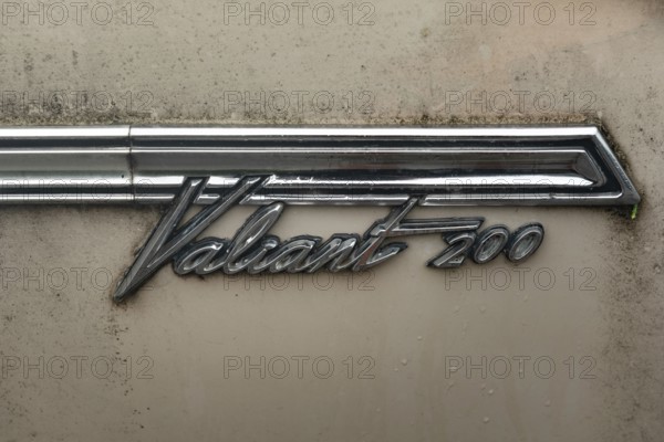 Rhine Falls, Switzerland. 26th September 2024 Badge of a Plymouth Valiant 200 four-door sedan car,