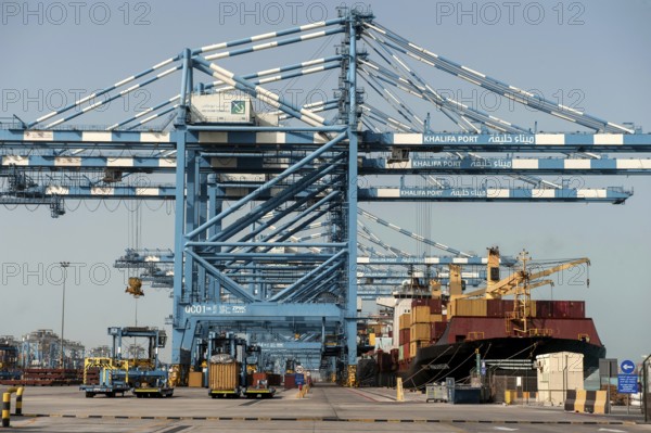 Abu Dhabi, United Arab Emirates. June 27th 2019. Shipping containers being loaded onto a ship at