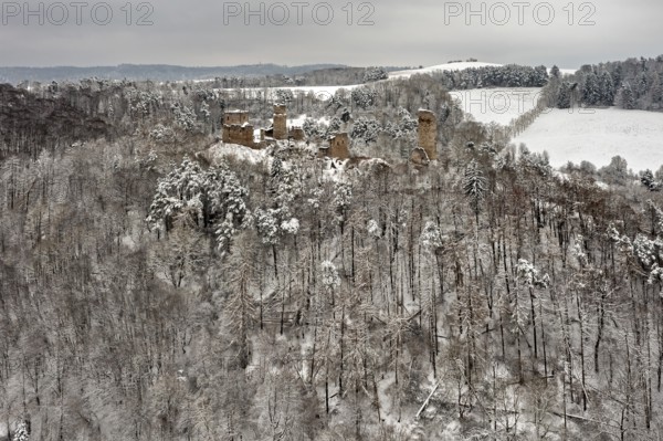 Wide view of a ruin in a wintry forest with snow-covered hills, The Brandenburg in the Werra Valley