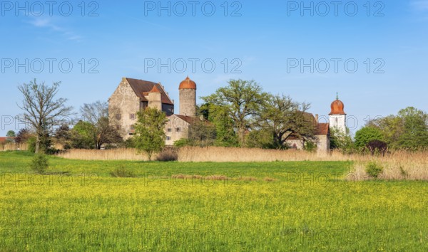 View over wildflower meadow at Sommersdorf Castle near Burgoberbach in the Altmühltal, Middle