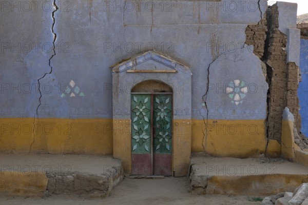 Aswan, Egypt. December 10th 2022 Traditional brightly coloured painted Nubian house in a village on