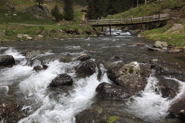 Torrent and old wooden bridge on the Transfogarasan High Road, Transfagarasan, connects the Arges