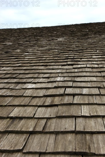 Close-up of a traditional wooden shingle roof, building materials, wood shingles