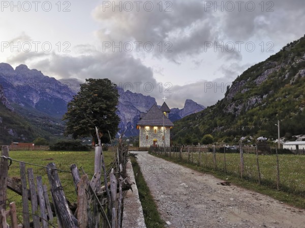 Lonely church in Theth, in a mountainous landscape at dusk with peaceful atmosphere, Peaks of the