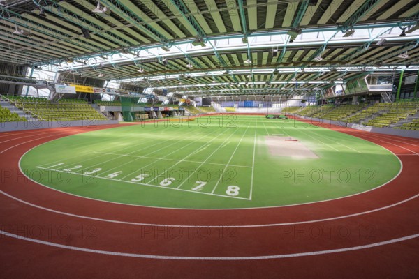 Round green running track with numbered markings in a sports hall, Glaspalast Sindelfingen,