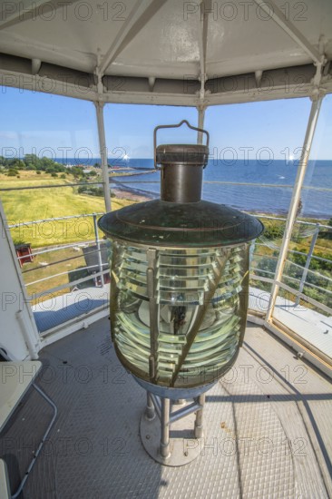 The lens of Smygehuk lighthouse and view towards Smygehamn in Trelleborg municipality, Baltic Sea,