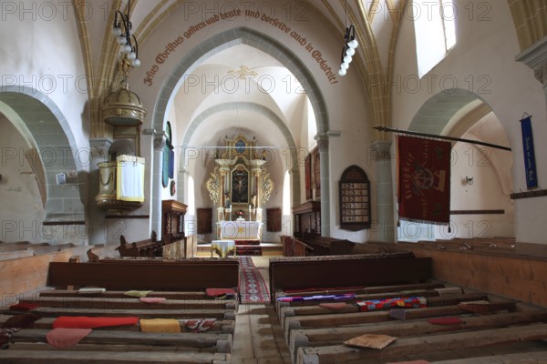 Pews, interior of the fortified church in Honigberg, Harman, Burzenland in Transylvania, Romania