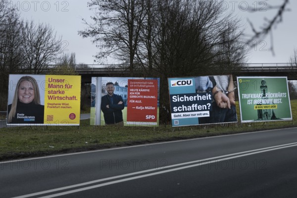 Large election posters are standing on a street in the northwest of Frankfurt. The Hessian state