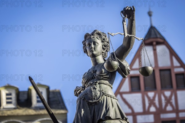 Justice, statue of the Roman goddess of justice. Römerberg, Downtown Frankfurt am Main, Hesse,